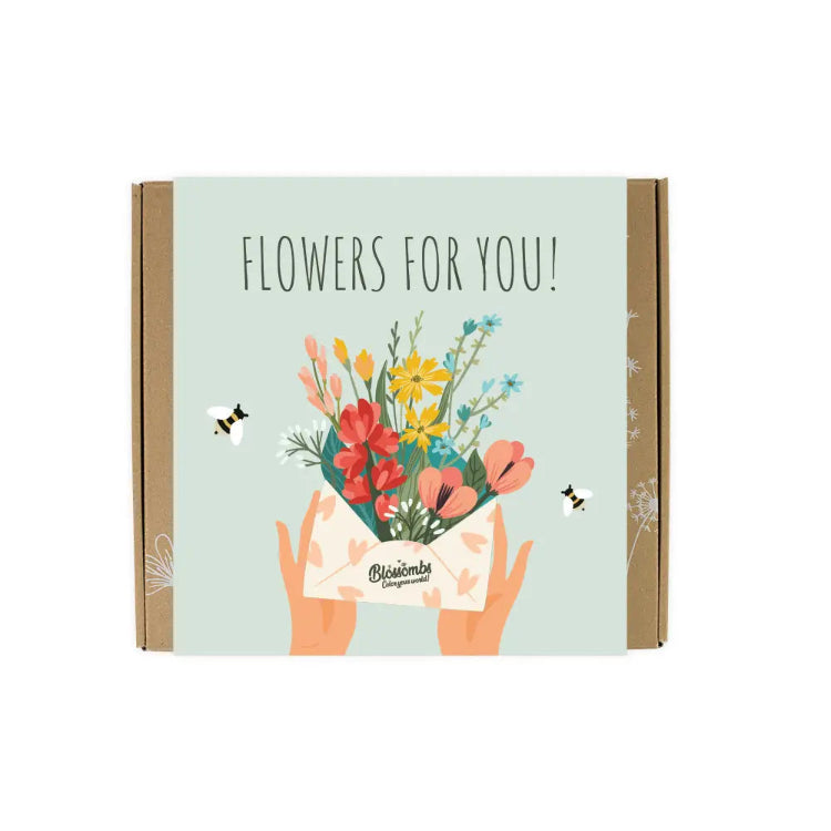 Gaveæske fra Blossombs med blomsterfrø og teksten Flowers for you til en personlig værtsgave.