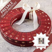 Julekalender fra Xocolatl – 24 æsker samlet i en smuk krans, hver med to fyldte danske chokolader med bl.a. karamel, ganache og nougat.	