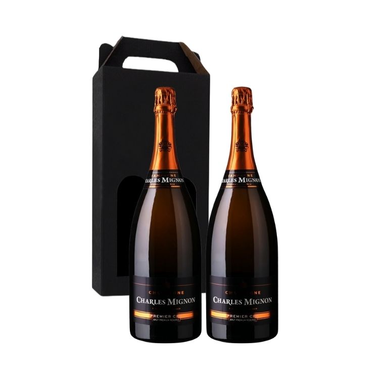 To flasker Charles Mignon Champagne Premier Cru Brut i en sort gaveæske.