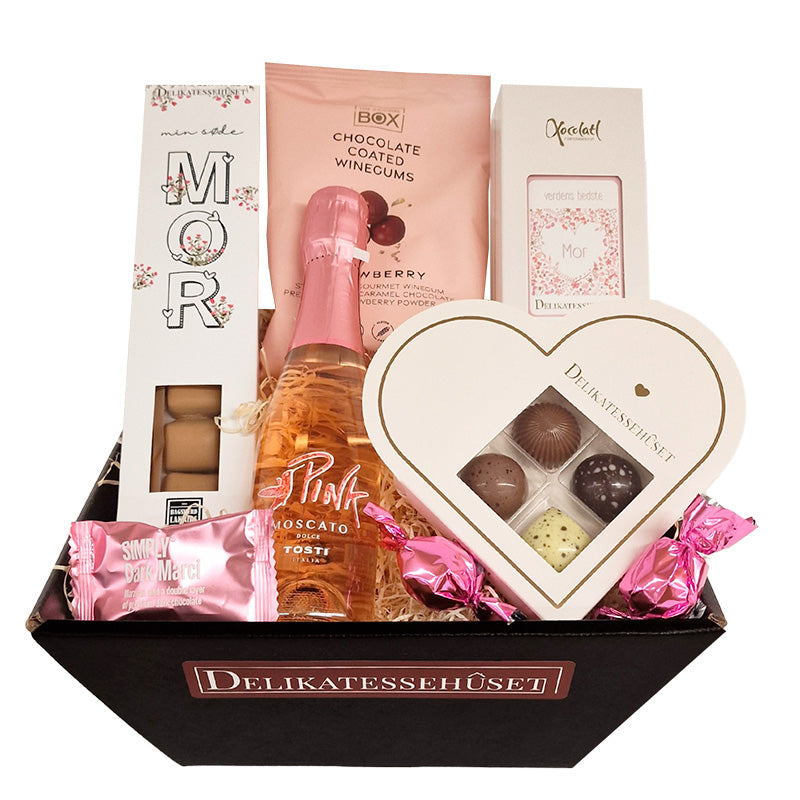 Flot lyserød gavekurv med moscato, chokolade, lakrids og vingummi til morsdag