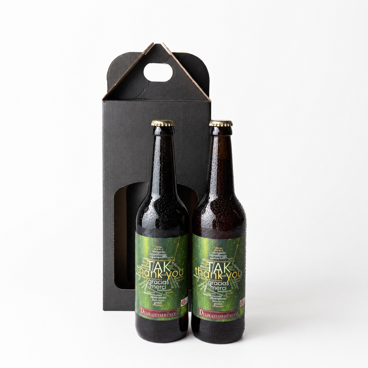 Gaveæske med 2 flasker ‘TAK’ øl fra Grauballe Bryghus, designet af Delikatessehuset som en gave til at sige tak.