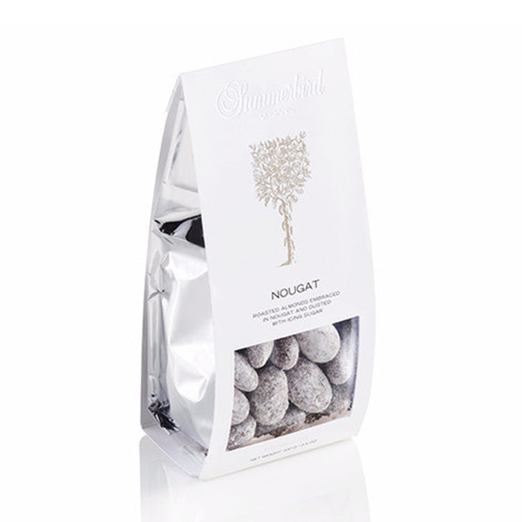 Hvid pose med Summerbird nougat mandler overtrukket med nougat og flormelis.